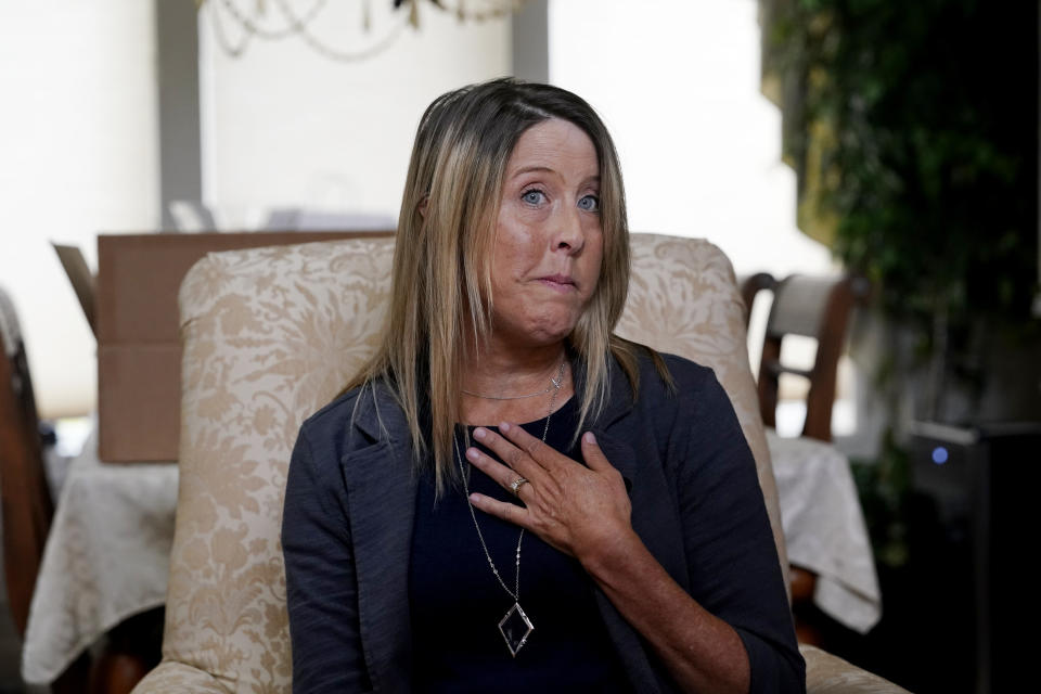 Teri Mann Whyatt speaks about her uncle, William Edward Mann, who died on the USS Arizona during the bombing of Pearl Harbor, at her home Wednesday, July 14, 2021, in Newcastle, Wash. In recent years, the U.S. military has taken advantage of advances in DNA technology to identify the remains of hundreds of sailors and Marines who died in the 1941 bombing of Pearl Harbor and has sent them home to their families across the country for burial. The remains of 85 unknowns from the USS Arizona, which lost more men during the attack than any other ship, haven't received this treatment, however. (AP Photo/Elaine Thompson)