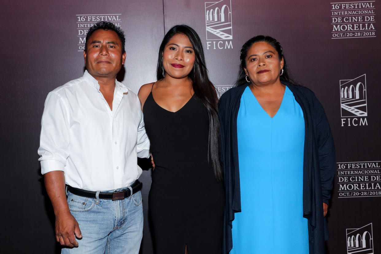 MORELIA, MEXICO - OCTOBER 24: Yalitza Aparicio poses with her parents during the red carpet of Netflix film 'Roma' directed by Alfonso Cuaron as part of Festival Internacional de Cine de Morelia at Teatro Ocampo on October 23, 2018 in Morelia, Mexico. (Photo by Victor Chavez/Getty Images)