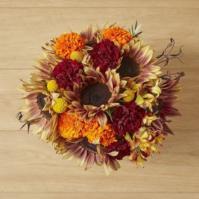 <p><a href="https://go.redirectingat.com?id=74968X1596630&url=https%3A%2F%2Fbouqs.com%2Fflowers%2Fsunflowers%2Fsunflowers-burgundy-carnations-orange-alstroemeria&sref=https%3A%2F%2Fwww.thepioneerwoman.com%2Fholidays-celebrations%2Fg44750846%2Fthanksgiving-flowers%2F" rel="nofollow noopener" target="_blank" data-ylk="slk:Shop Now;elm:context_link;itc:0;sec:content-canvas" class="link ">Shop Now</a></p><p>Fireside Glow Arrangement</p><p>bouqs.com</p><p>$84.00</p><span class="copyright">Bouqs</span>