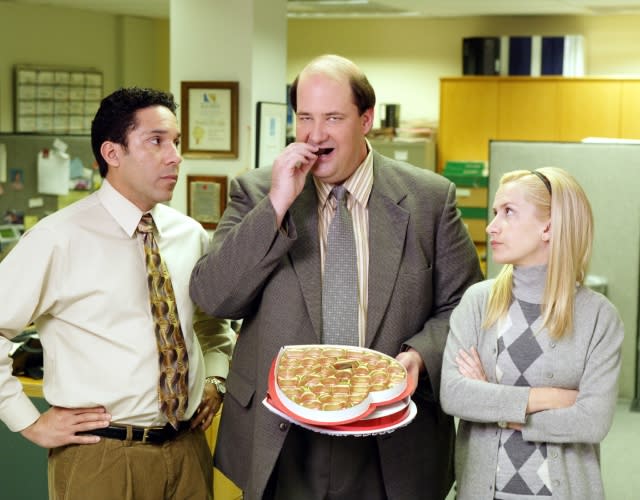 THE OFFICE, Oscar Nunez, Brian Baumgartner, Angela Kinsey. Photo: Paul Drinkwater / © NBC / Courtesy: Everett Collection.