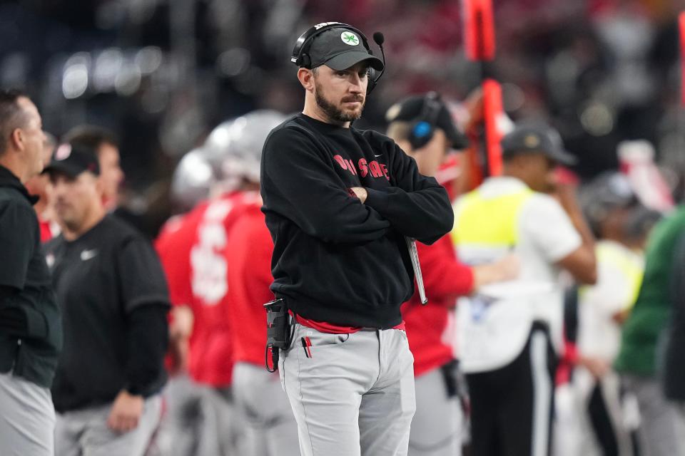 Dec 29, 2023; Arlington, Texas, USA; Ohio State Buckeyes special teams coordinator Parker Fleming watches from the sideline during the Goodyear Cotton Bowl Classic against the Missouri Tigers at AT&T Stadium. Ohio State lost 14-3.