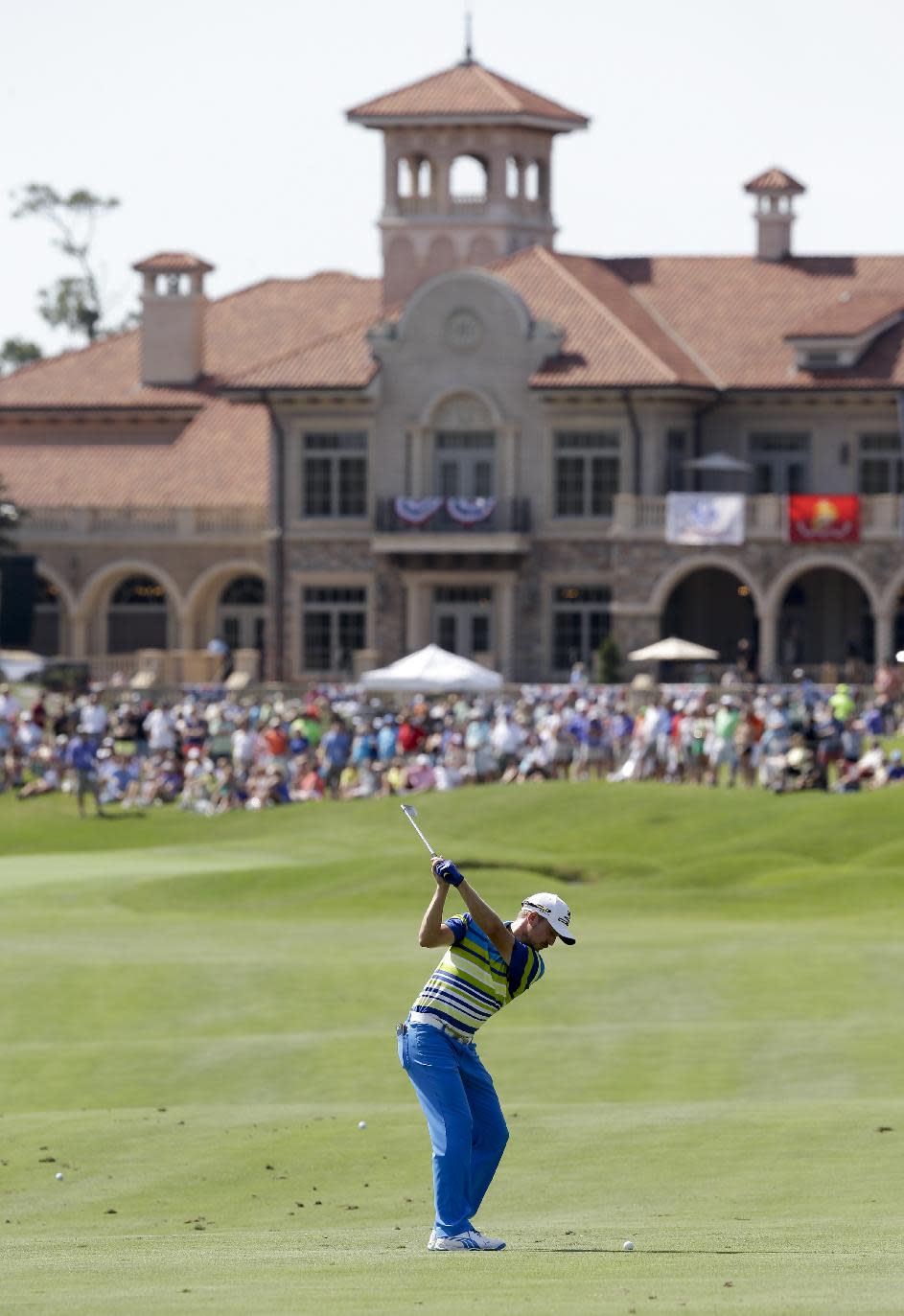 Jonas Blixt, of Sweden, hits from the 18th fairway to the green during a practice round for The Players championship golf tournament at TPC Sawgrass in Ponte Vedra Beach, Fla., Wednesday, May 7, 2014. (AP Photo/John Raoux)