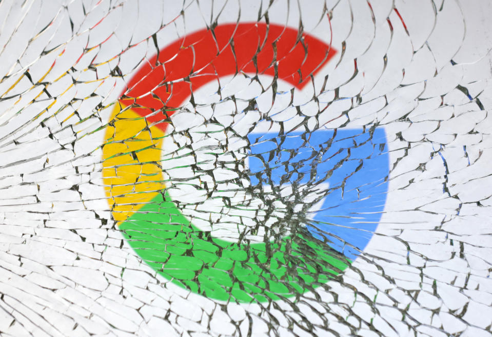 Google logo is seen through broken glass in this illustration taken, January 25, 2023. REUTERS/Dado Ruvic/Illustration