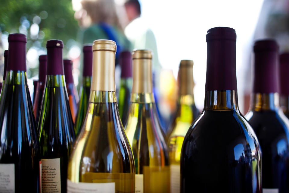 Detail of assorted red and white wines alcohol on a table