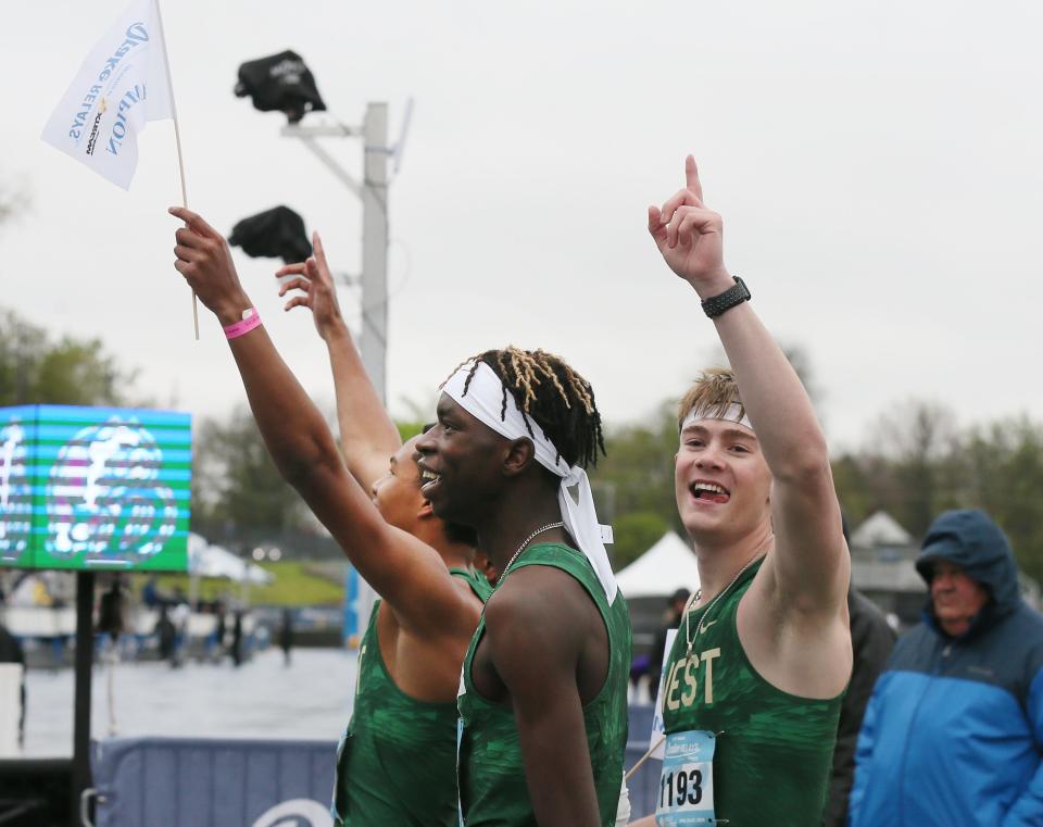 Iowa City West boys celebrate after winning the distance medley relay at the Drake Relays on Friday in Des Moines.
