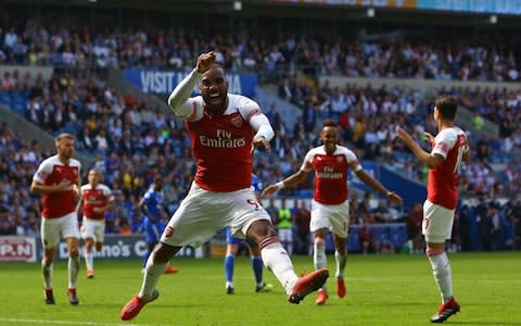  Arsenal's French striker Alexandre Lacazette (C) celebrates after playing the assist for their second goal scored by Arsenal's Gabonese striker Pierre-Emerick Aubameyang (2nd R) during the English Premier League football match between between Cardiff City and Arsenal at Cardiff City Stadium in Cardiff, south Wales on September 2, 2018 - Credit: AFP