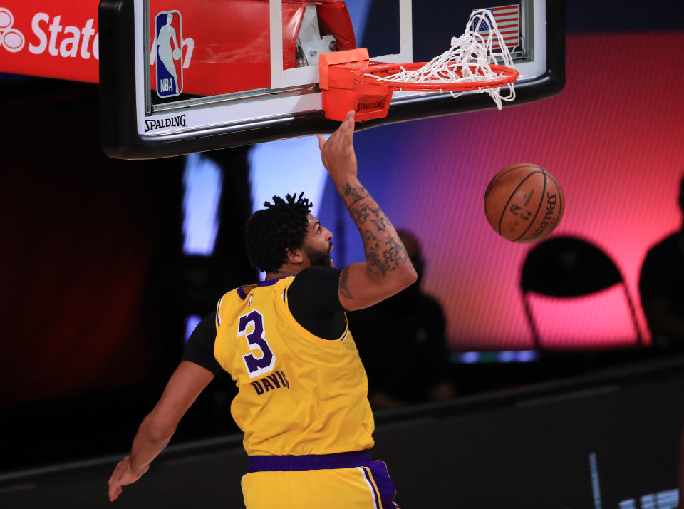 Anthony Davis dunks two of his game-high 29 points for the Lakers on Thursday. (Michael Reaves/Getty Images)