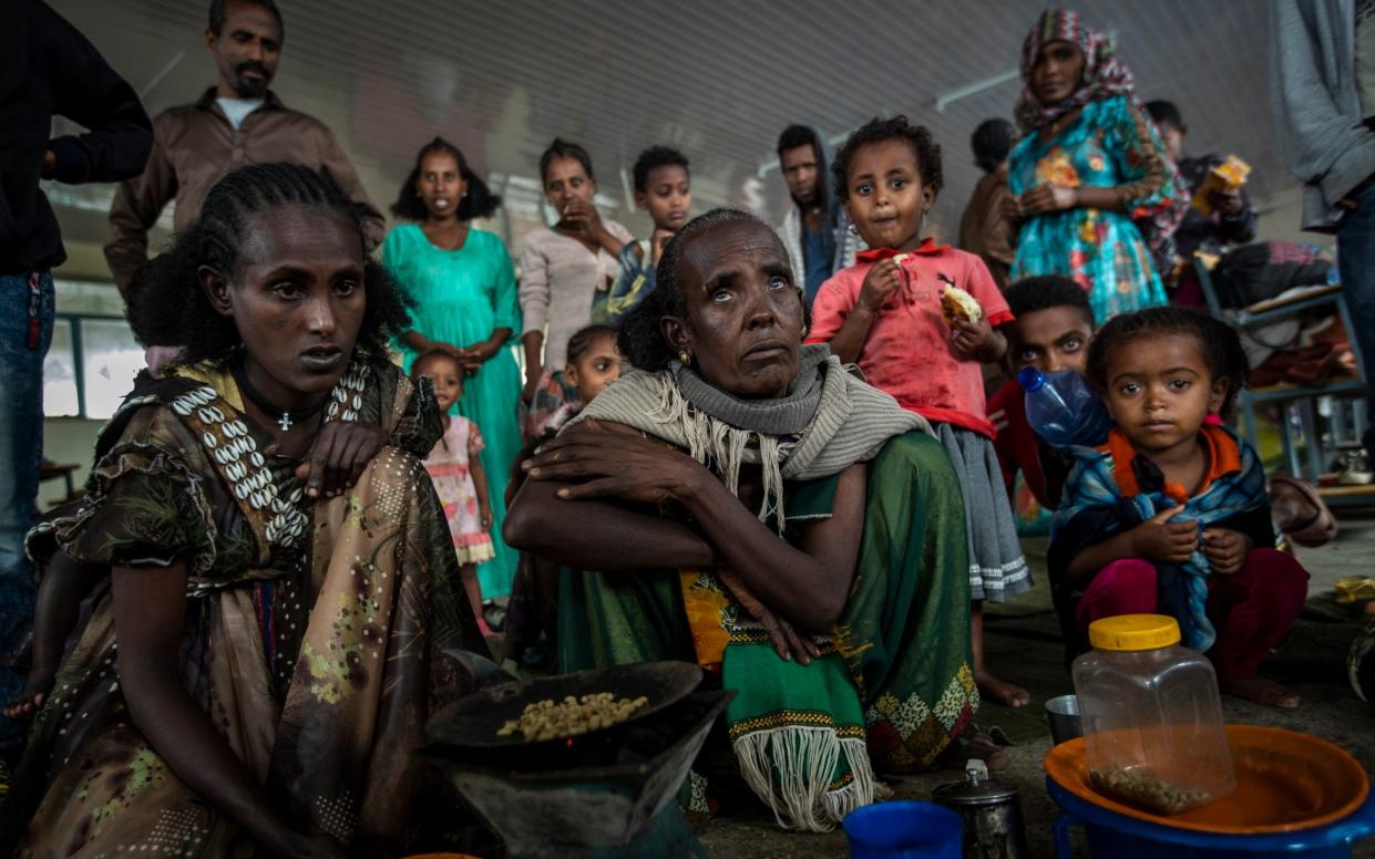 Tigrayan women and children displaced from conflict shelter in a school - Ben Curtis/AP