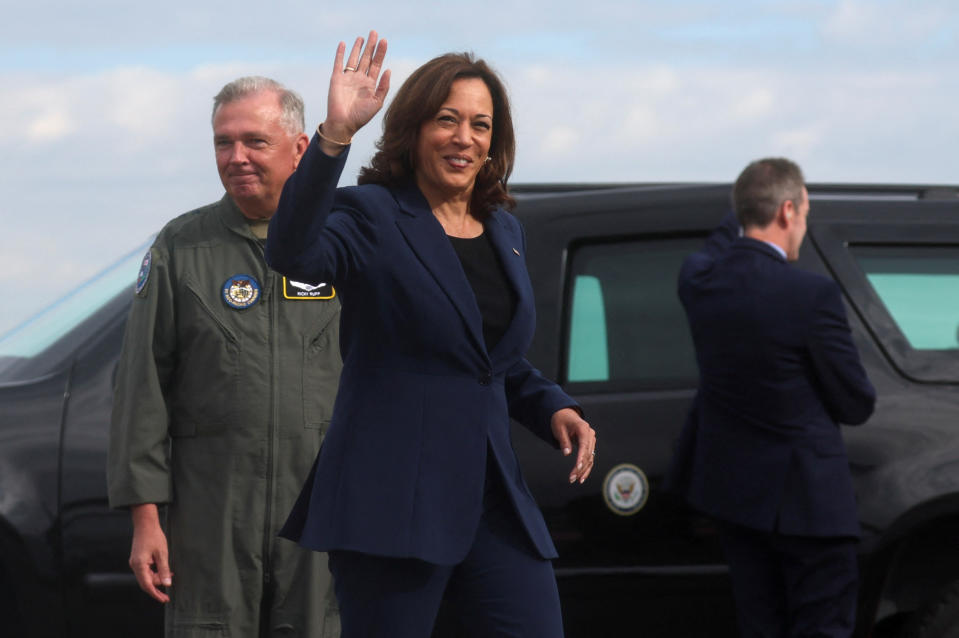 U.S. Vice President Kamala Harris, next to Lt. General Ricky N. Rupp, Commander, U.S. Air Force Japan, waves at Yokota Air Base, near Tokyo, Japan, September 29, 2022. REUTERS/Leah Millis/Pool