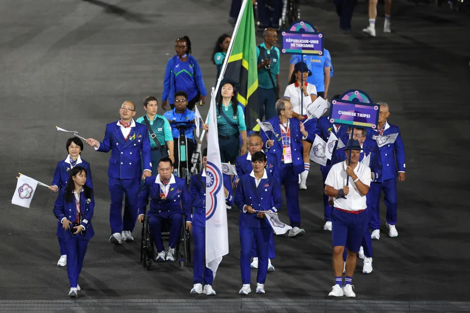 PARIS, FRANCE - AUGUST 28: Po Yen Chen and Ya-Ting Liu, Flag Bearers of Team Team Chinese Taipei, hold their national flag as they parade during the opening ceremony of the Paris 2024 Summer Paralympic Games at Place de la Concorde on August 28, 2024 in Paris, France. (Photo by Elsa/Getty Images)