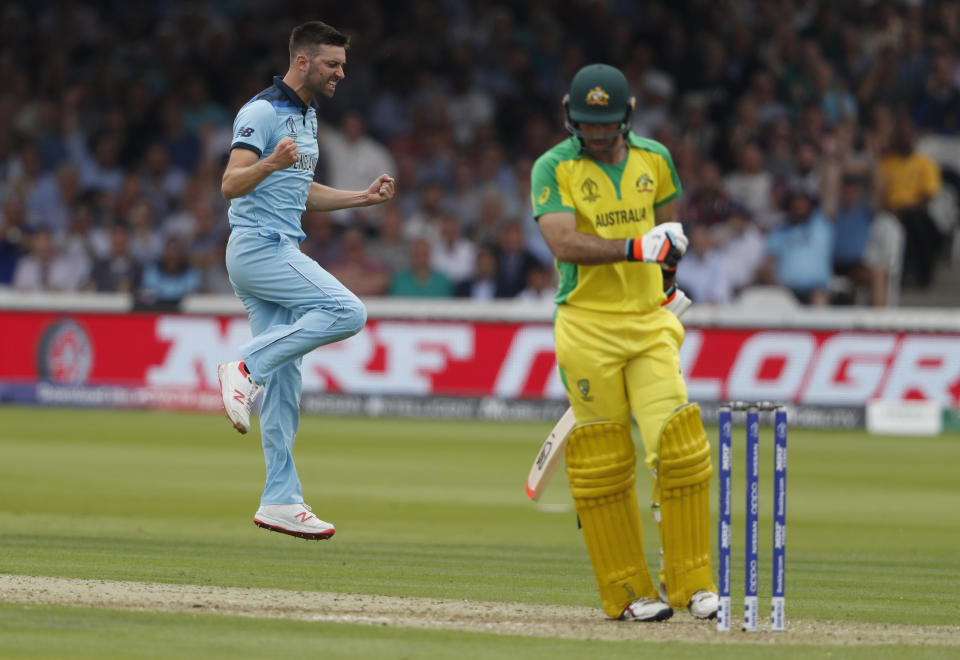 CORRECTS ID England's Mark Wood celebrates after taking the wicket of Australia's Glenn Maxwell caught behind during their Cricket World Cup match between England and Australia at Lord's cricket ground in London, Tuesday, June 25, 2019. (AP Photo/Alastair Grant)