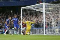 Chelsea's John Terry (L) scores a goal against West Ham United during their English Premier League soccer match at Stamford Bridge in London, December 26, 2014. REUTERS/Stefan Wermuth