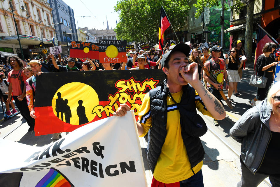 Protesters are seen during the Invasion Day rally in Melbourne.