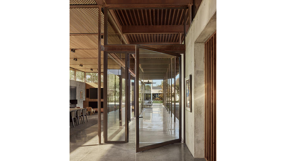 A look at the large glass doors and tall ceilings a part of the Lake Fiato designed home. - Credit: Casey Dunn