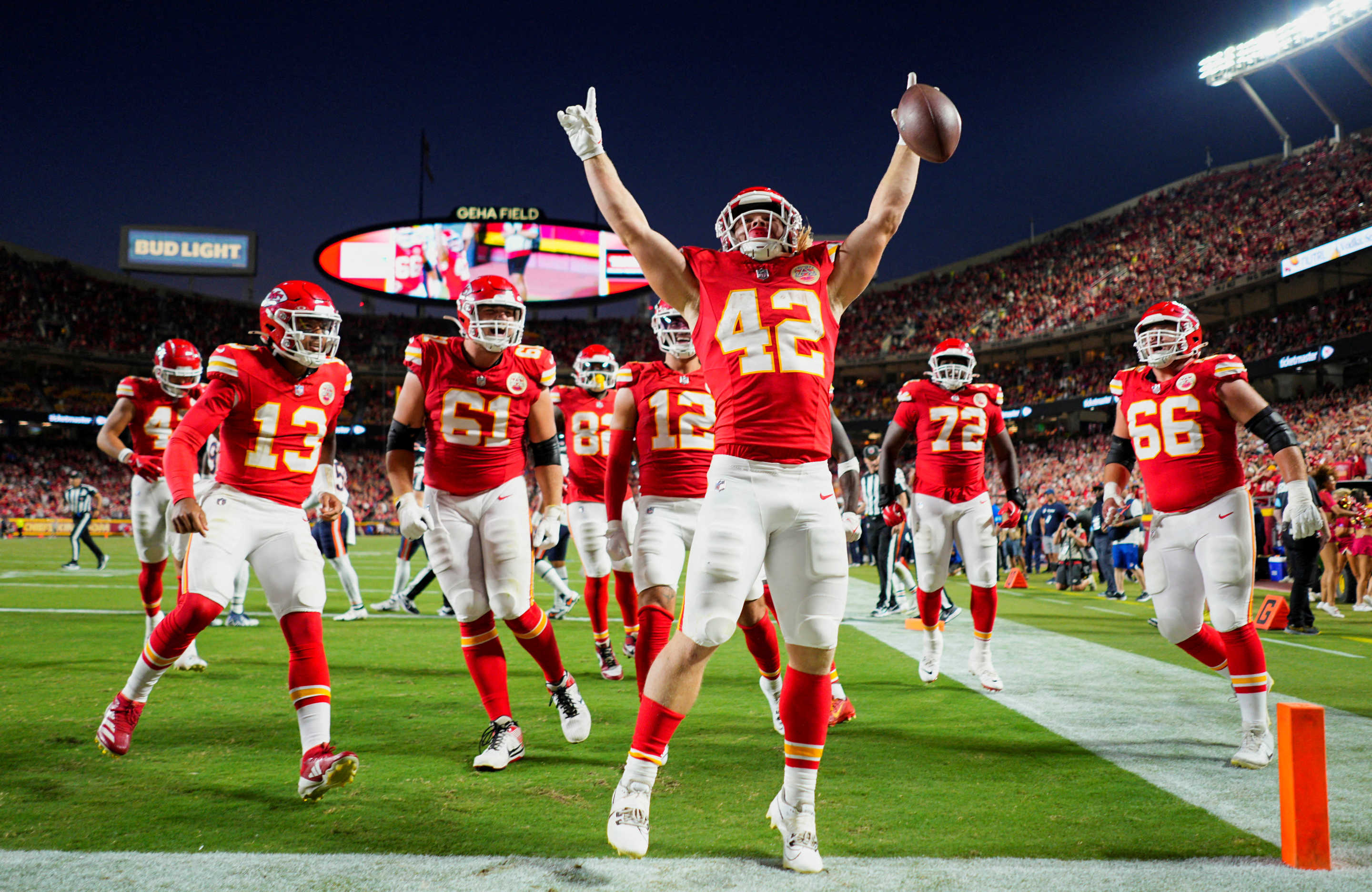 Aug 22, 2024; Kansas City, Missouri, USA; Kansas City Chiefs running back Carson Steele (42) celebrates with teammates after scoring a touchdown during the first half against the Chicago Bears at GEHA Field at Arrowhead Stadium. The touchdown would be called back. Mandatory Credit: Jay Biggerstaff-USA TODAY Sports     TPX IMAGES OF THE DAY