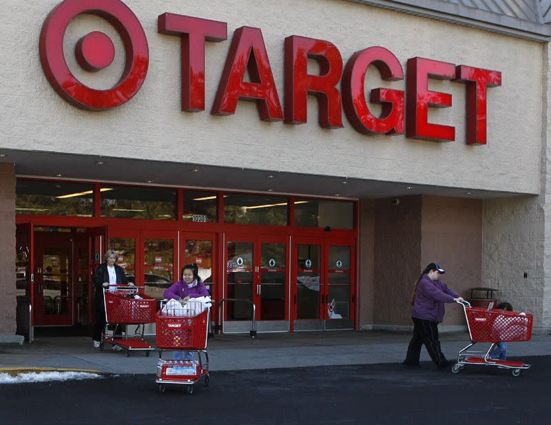 FILE PHOTO: Shoppers exit a Target store with their purchases in Fairfax