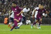 <p>Manchester City’s Ilkay Gundogan (left) scores a penalty to put his side firmly in the driving seat </p>