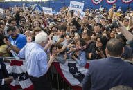 Democratic presidential candidate Sen. Bernie Sanders, I-Vt., greets supporters at a campaign event at Valley High School in Santa Ana, Calif., Friday, Feb. 21, 2020. (AP Photo/Damian Dovarganes)