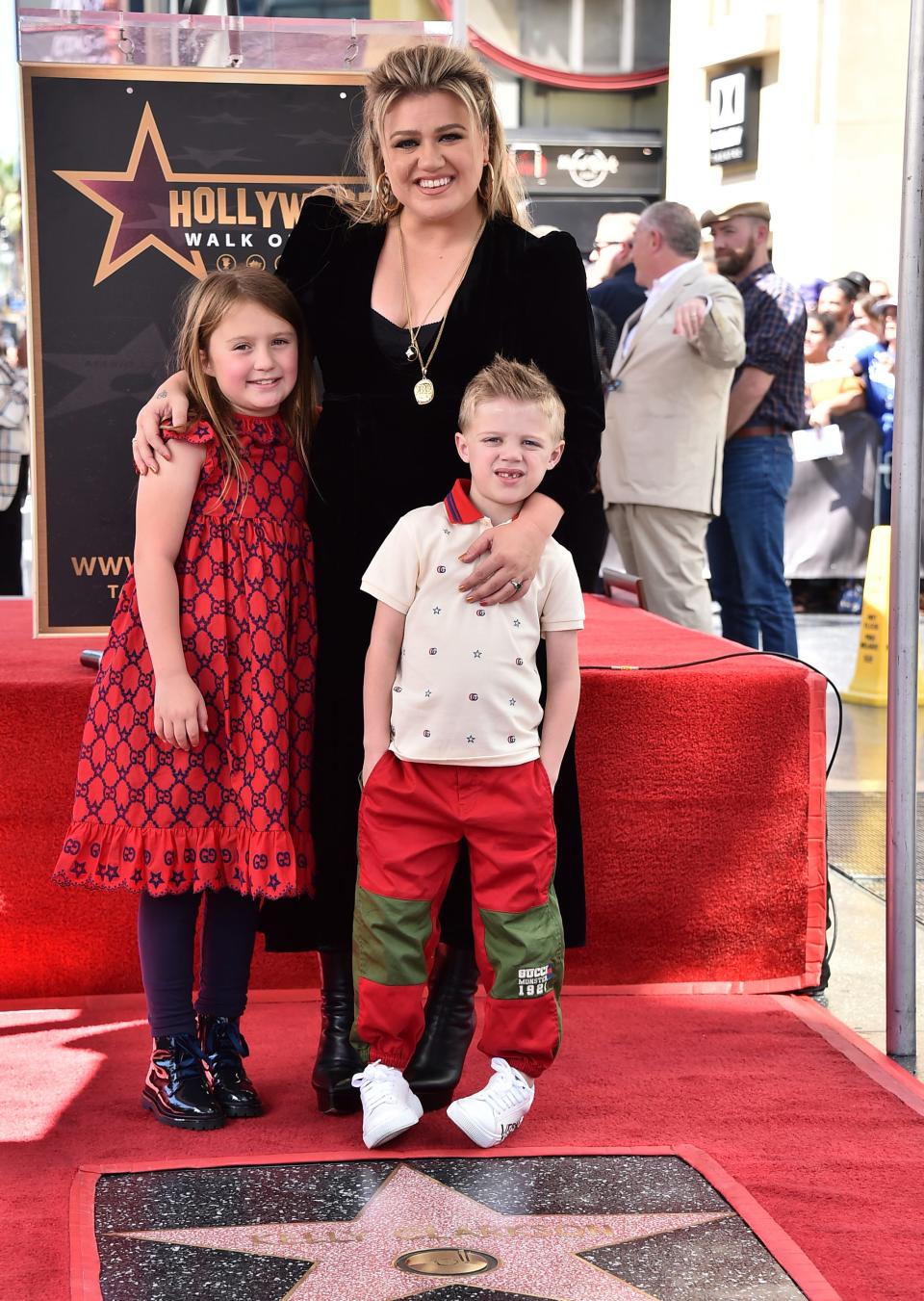 Singer and talk show host Kelly Clarkson and her children River Rose, left, and Remington, right, pose atop Clarkson's new star on the Hollywood Walk of Fame during a ceremony on Monday, Sept. 19, 2022, in Los Angeles.