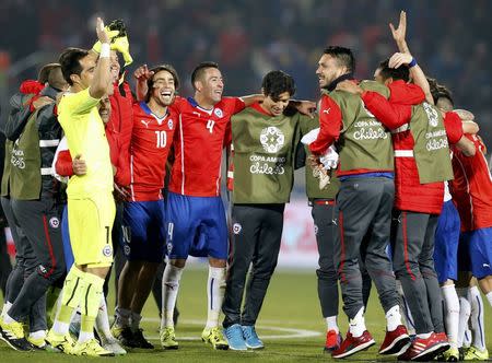 Chile players celebrate after defeating Peru in their Copa America 2015 semi-final soccer match at the National Stadium in Santiago, Chile, June 29, 2015. REUTERS/Henry Romero