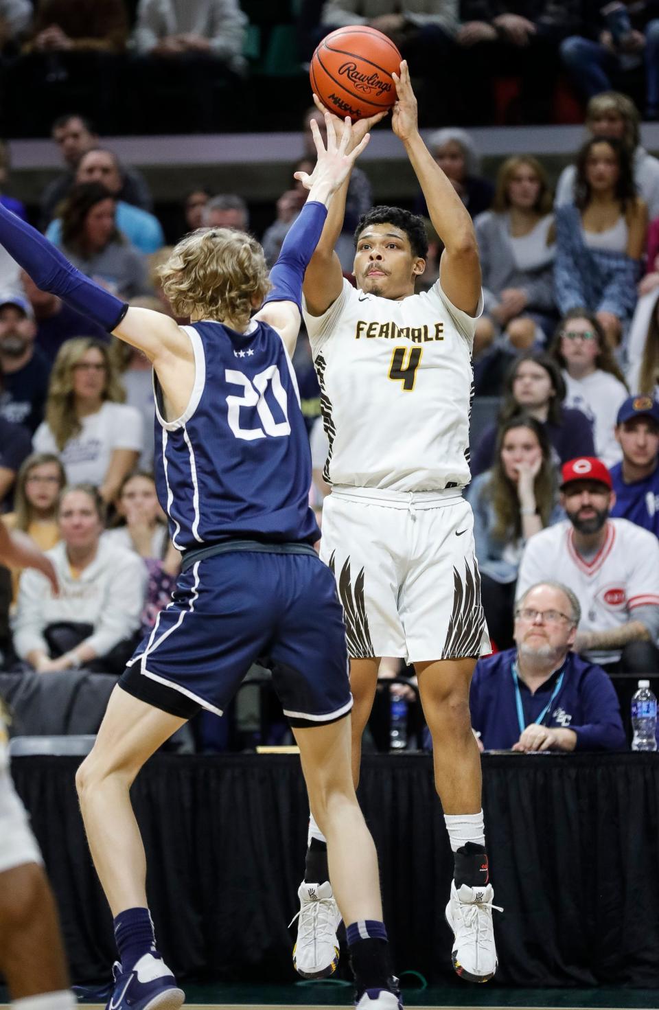 Ferndale guard Noah Blocker (4) makes a jump shot against Grand Rapids South Christian forward Sam Medendorp (20) during the second half of MHSAA boys Division 2 final at Breslin Center in East Lansing on Saturday, March 25, 2023.