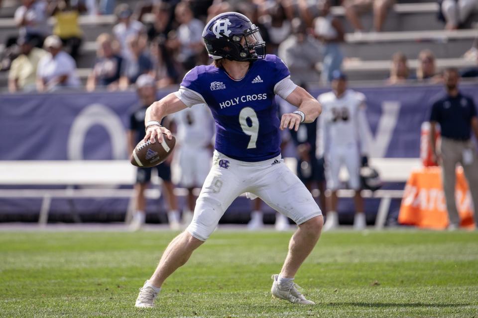 Holy Cross quarterback Matthew Sluka drops back to throw a touchdown to Jordan Fuller in the second quarter Saturday at Fitton Field.