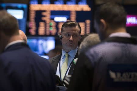 Traders work on the floor of the New York Stock Exchange May 29, 2014. REUTERS/Brendan McDermid