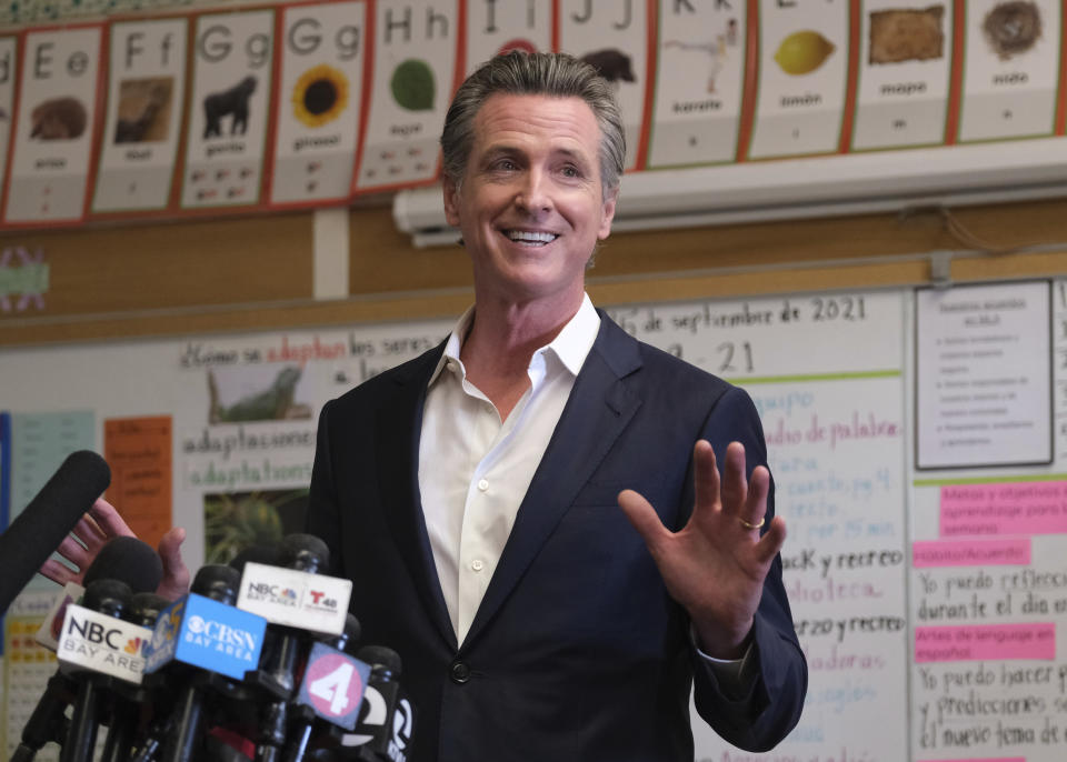 Gov. Gavin Newsom speaks to the press after visiting with students at Melrose Leadership Academy, a TK-8 school in Oakland, Calif., on Wednesday, Sept. 15, 2021, one day after defeating a Republican-led recall effort. (AP Photo/Nick Otto)