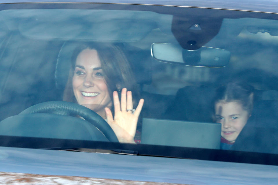 The Duchess of Cambridge and her daughter Princess Charlotte arrive for the Queen's Christmas lunch at Buckingham Palace, London. (Photo by Aaron Chown/PA Images via Getty Images)