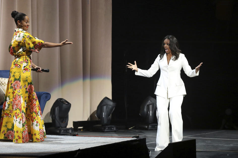 Tracee Ellis Ross, left, introduces former first lady Michelle Obama at the "Becoming: An Intimate Conversation with Michelle Obama" event at the Forum on Thursday, Nov. 15, 2018, in Inglewood, Calif. (Photo by Willy Sanjuan/Invision/AP)