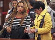 Terri Hernandez, mother of former New England Patriots tight end Aaron Hernandez and his fiancee Shayanna Jenkins watch in court during Hernandez' appearance at the Fall River Justice Center in Fall River, Massachusetts December 23, 2013. The former NFL tight end is charged in the fatal shooting of his friend, Odin Lloyd, in June 2013. REUTERS/Matt Stone/Pool (UNITED STATES - Tags: CRIME LAW SPORT FOOTBALL)