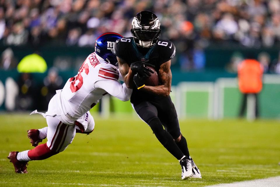 The Giants' Tony Jefferson tackles Philadelphia's DeVonta Smith after a catch on January 8. MATT SLOCUM/The Associated Press