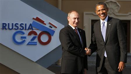 Russia's President Vladimir Putin (L) welcomes U.S. President Barack Obama before the first working session of the G20 Summit in Constantine Palace in Strelna near St. Petersburg, September 5, 2013. REUTERS/Grigory Dukor