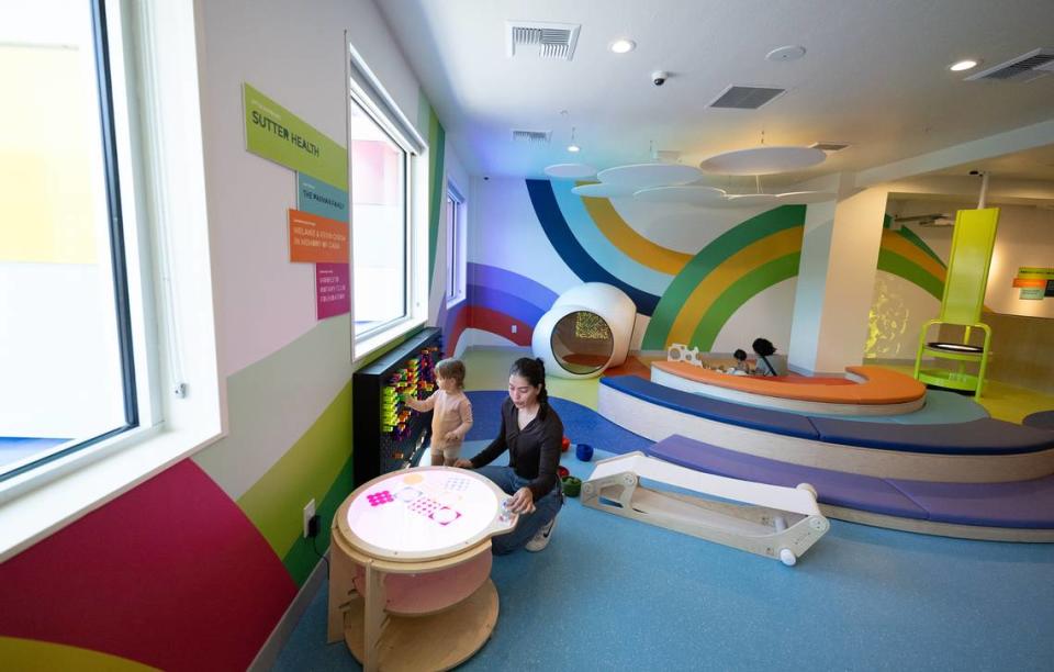 Nethie Bennen plays with Margot Norris, 2, in the little rainbows exhibit at the Modesto Children’s Museum in Modesto, Calif., Thursday, Sept. 28, 2023.