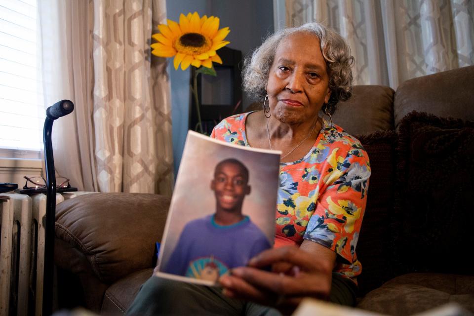 Elvis Ellis poses for a portrait while holding up a photo of her grandson Marcus Donald in Ellis’ home in Memphis, Tenn., on March 20, 2023. Donald died while in custody at Shelby County Jail and another inmate has been charged with his murder. 