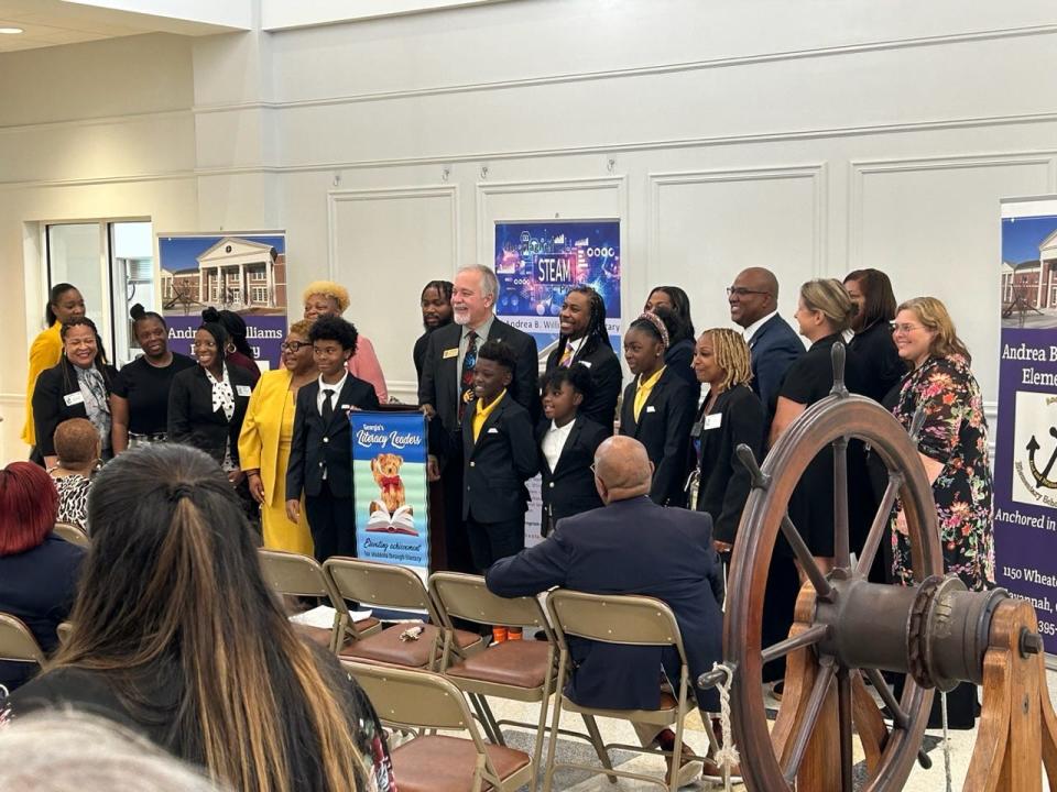 GA State Superintendent Richard Woods presents a Literacy Banner to one of seven elementary schools who improved their literacy scores by 15 % or more