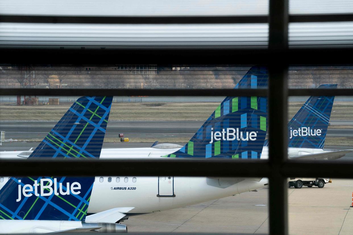 JetBlue planes at Ronald Reagan Washington National Airport on Jan. 18, 2022.