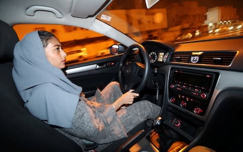 Hannan Iskandar drives her car in her neighborhood, in Al Khobar - Credit: Reuters