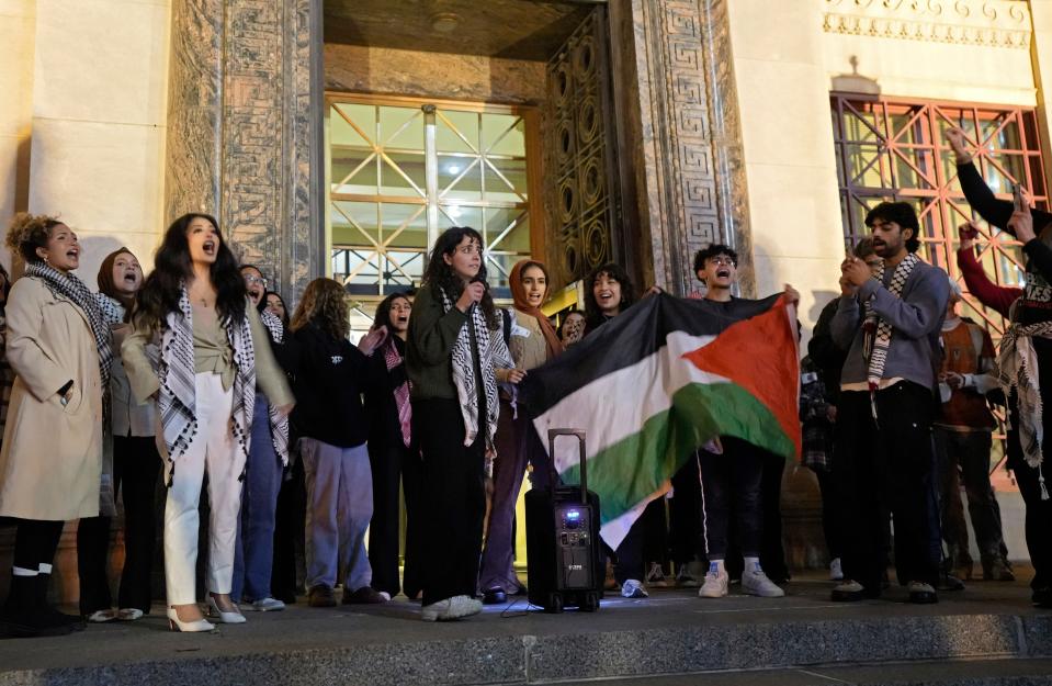 Pro-Palestine supporters stand on the steps of Columbus City Hall after attending the Nov. 13 City Council meeting where they asked councilmembers to officially support a resolution calling for a ceasefire in the Israel-Hamas war in Gaza.