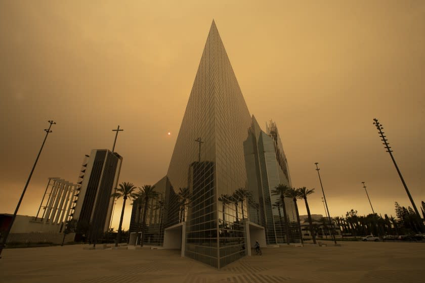 GARDEN GROVE, CA - SEPTEMBER 09: The sun is partially obscured with ash from Southland wildfires at the Christ Cathedral in Garden Grove Wednesday, Sept. 9, 2020. With so many fires burning, millions of people in the Bay Area, Central Valley and parts of Southern California are breathing dangerous levels of particle pollution. (Allen J. Schaben / Los Angeles Times)