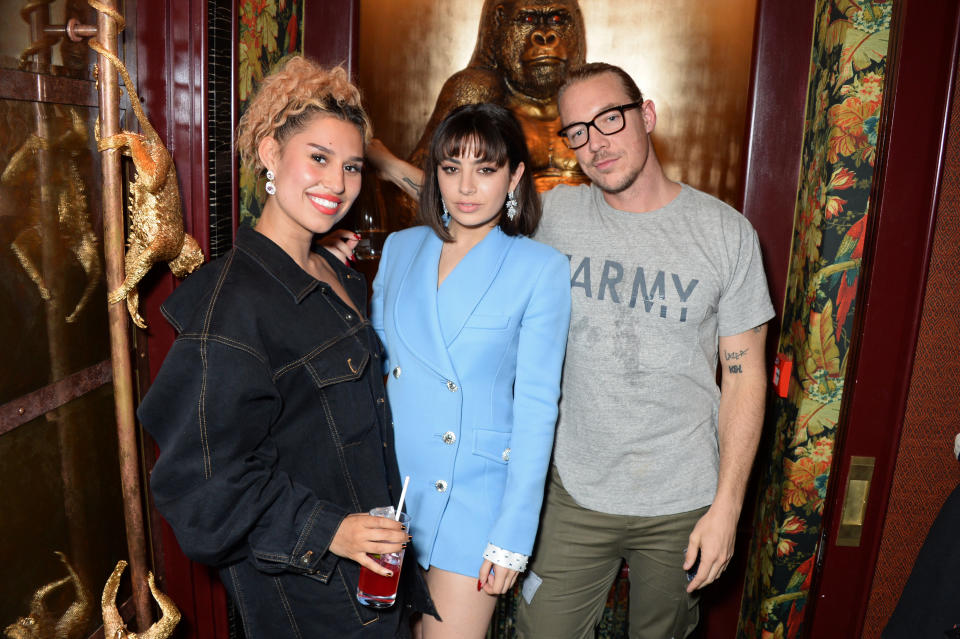LONDON, ENGLAND - JUNE 10:  (L to R) Raye, Charli XCX and Diplo attend the GQ Style and Browns LFWM Party at Annabels on June 10, 2018 in London, England.  (Photo by David M. Benett/Dave Benett/Getty Images for Annabel's)