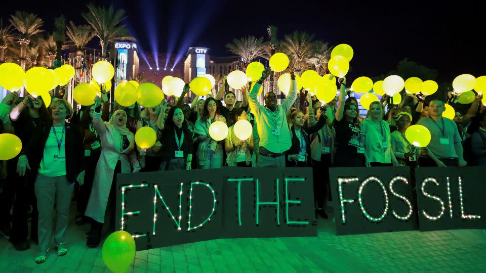 A demonstration at COP28 in Dubai on Monday urging nations to phase out fossil fuels. - Thaier Al-Sudani/Reuters