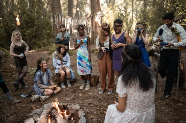 Doomcoming L–R: Natalie in leopard print, two Yellowjacket teammates, Javi (Luciano Leroux), Akilah, Van (Liv Hewson), Taissa (Jasmin Savoy Brown), Misty (Samantha Hanratty) and Coach Ben (Steven Krueger) look on as Lottie (foreground) sings Seal's 1994 hit 'Kiss From a Rose.'<p>Photo: Kailey Schwerman/Courtesy of Showtime</p>