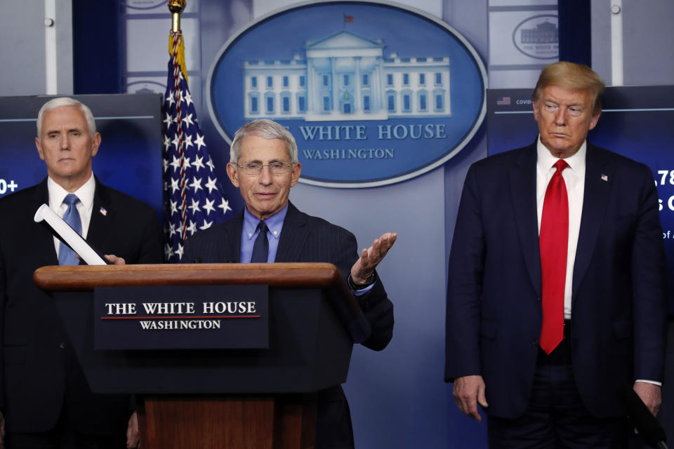 FILE - In this April 17, 2020, file photo, President Donald Trump and Vice President Mike Pence listen as Dr. Anthony Fauci, director of the National Institute of Allergy and Infectious Diseases, speaks about the coronavirus in the James Brady Press Briefing Room of the White House in Washington. The Trump administration’s leading health experts on safely dealing with the novel coronavirus will be testifying in a Senate hearing by a videoconference after three of them and the committee's chairman were exposed to someone who tested positive for COVID-19. (AP Photo/Alex Brandon, File)