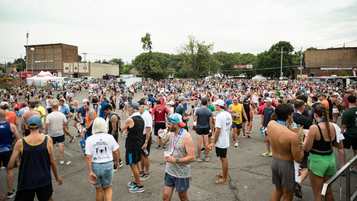 Runners, friends and family enjoy the Saranac Post-Race Party in Utica, NY on Sunday, July 9, 2023.