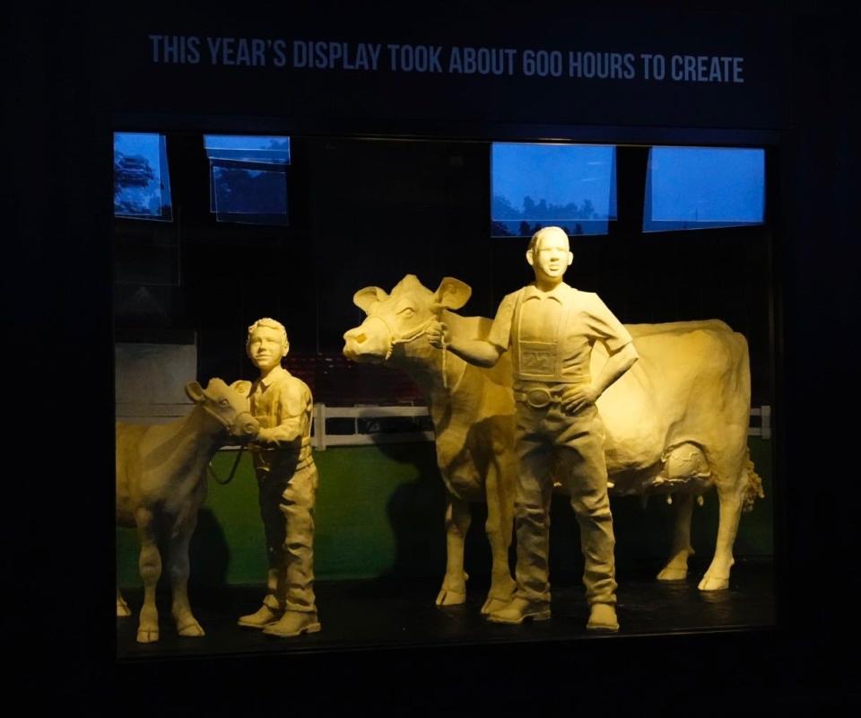 More than 2,500 pounds of butter were used on this year's butter sculpture display at the Ohio State Fair. It includes a cow and calf and other animals, including a chicken, pig and lamb.