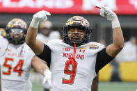 Maryland linebacker Fa'Najae Gotay celebrates after intercepting a North Carolina State pass during the first half of the Duke's Mayo Bowl NCAA college football game in Charlotte, N.C., Friday, Dec. 30, 2022. (AP Photo/Nell Redmond)