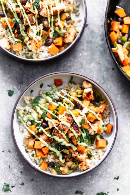 <p>Cooking for Keeps</p><p>These blackened chicken brown rice bowls are packed with spicy seared chicken, sweet potatoes, black beans, and hearty brown rice. They’re tossed with plenty of cilantro and then drizzled with an easy avocado cream sauce. Healthy and delicious!</p><p><strong>Get the recipe: <a href="https://www.cookingforkeeps.com/blackened-chicken-brown-rice-bowls-with-avocado-cream/" rel="nofollow noopener" target="_blank" data-ylk="slk:Blackened Chicken Brown Rice Bowls with Avocado Cream;elm:context_link;itc:0;sec:content-canvas" class="link rapid-noclick-resp">Blackened Chicken Brown Rice Bowls with Avocado Cream</a></strong></p>