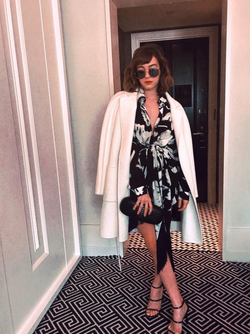“The black-and-white pattern on this dress with the fringe immediately sparked my interest when I saw it. And because New York weather is so unpredictable, I added the white coat as another fun layer. The sunglasses were the final touch.”
