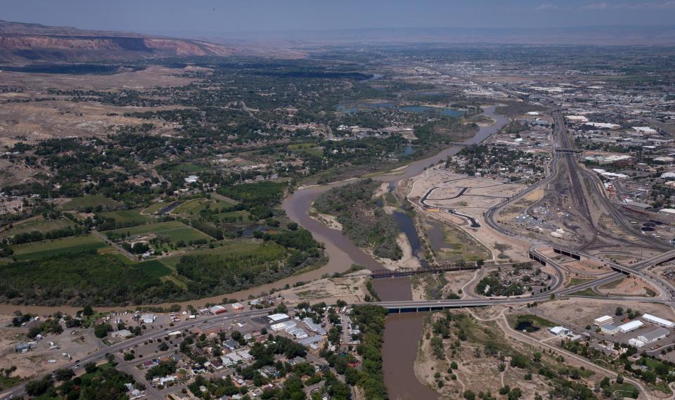 The confluence of the Colorado River (right, dark color) and the Gunnison River (left, lighter color) on Aug. 22, 2021, in Grand Junction, Colorado.
